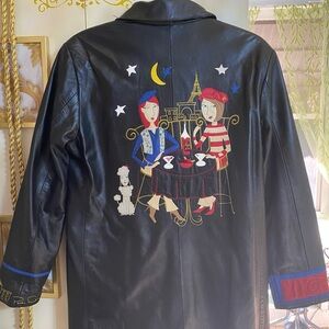 Unique, Well loved, leather coat with Parisian scene embroidered on back.